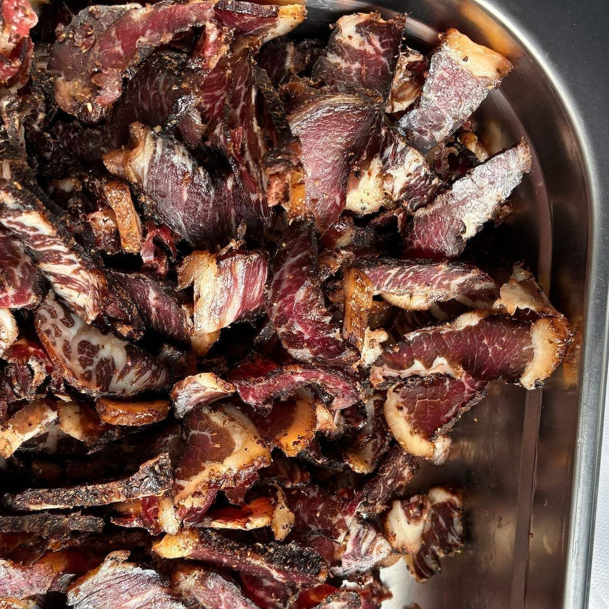 Biltong in a bowl sliced fatty biltong and looking delicious