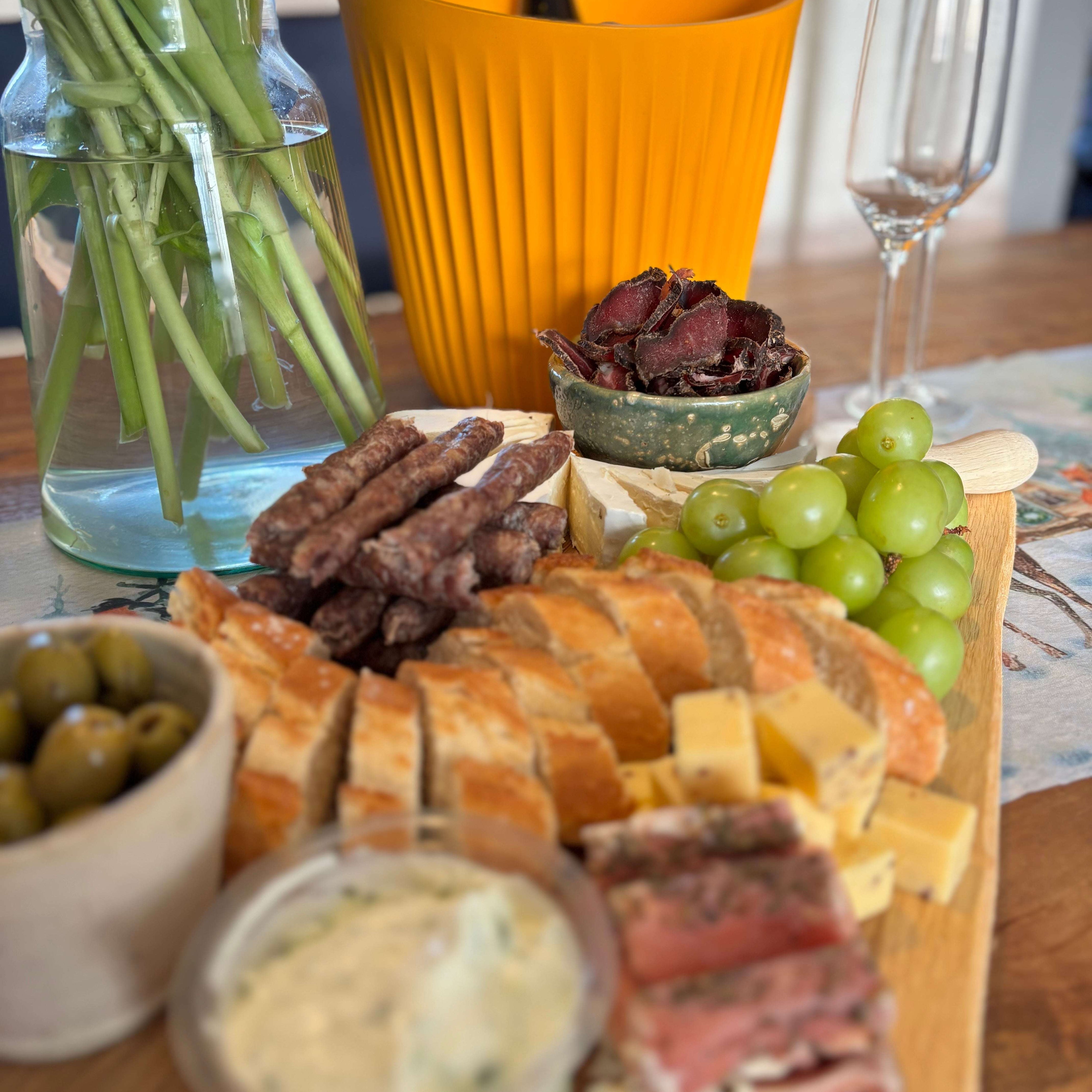 Platter of biltong with other snacks and sliced fatty biltong